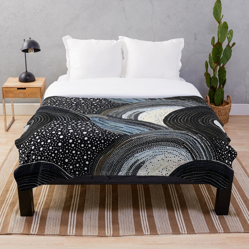 Plush blanket with indigenous-inspired artwork featuring native patterns, tribal designs, and sacred geometry