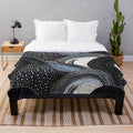 Plush blanket with indigenous-inspired artwork featuring native patterns, tribal designs, and sacred geometry
