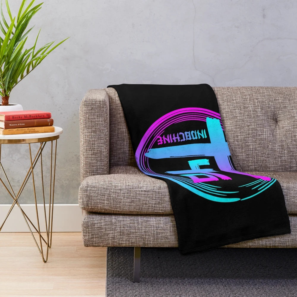 Colourful Indochine-inspired plush blanket with band logo