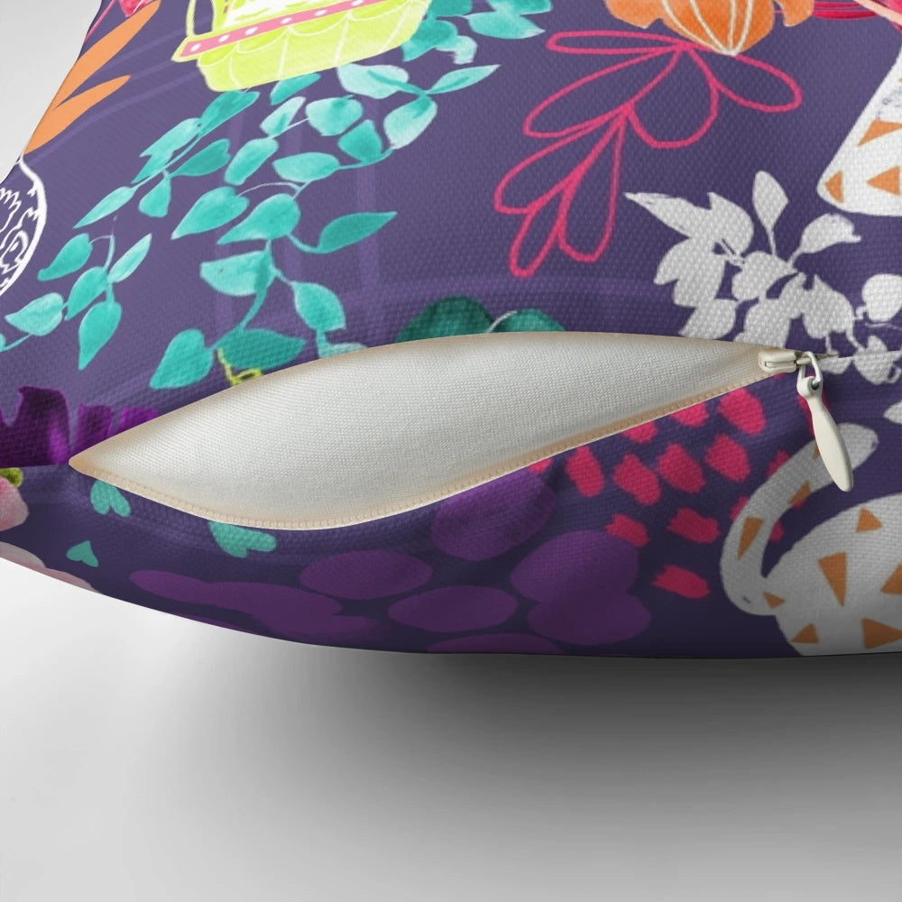 A colorful and modern pillow featuring a watercolor-style illustration of indoor plants, kittens, and a geometric design in shades of teal, pink, purple, and green.