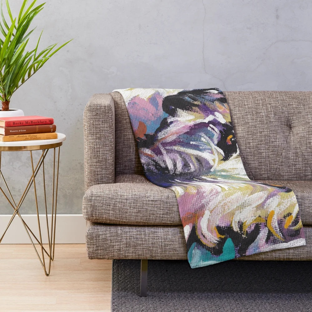 Colorful Irish Wolfhound dog portrait on a plush blanket