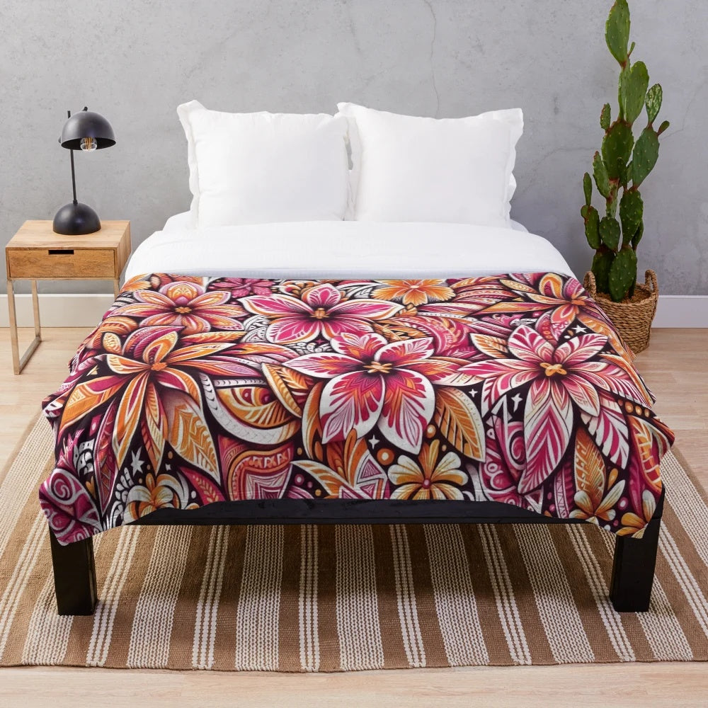 Tropical floral pattern plush blanket in warm tones of pink and orange