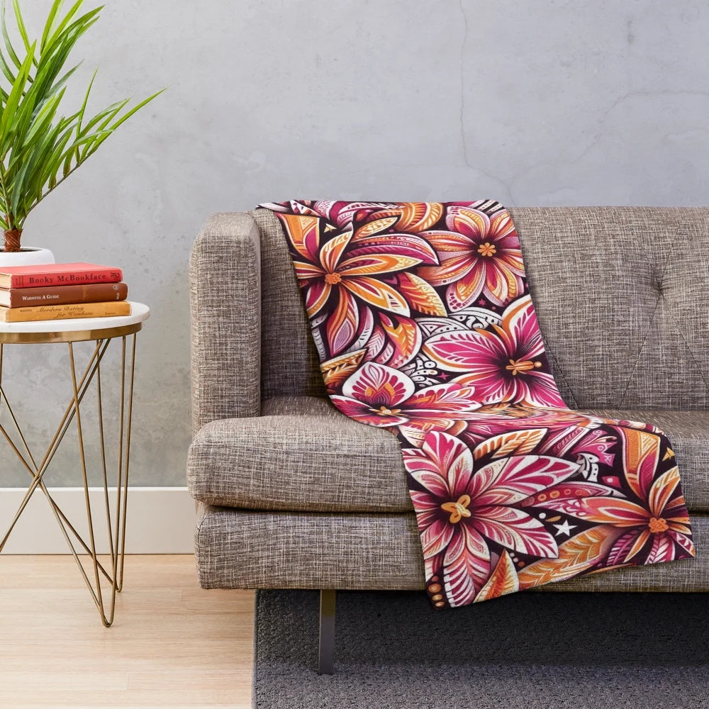 Tropical floral pattern plush blanket in warm tones of pink and orange