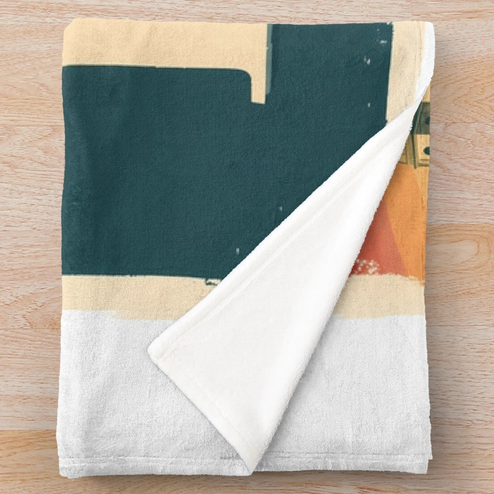 Plush blanket featuring a retro, abstract design of an Italian town