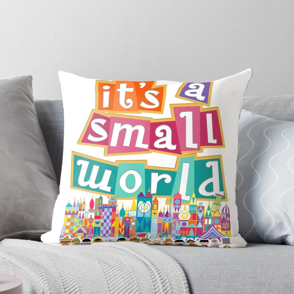 Colorful "It's a Small World" themed pillow with whimsical character designs