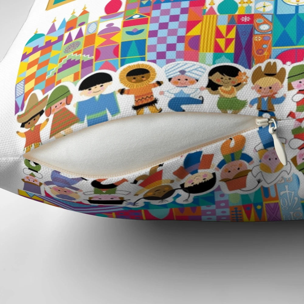 Colorful "It's a Small World" themed pillow with whimsical character designs