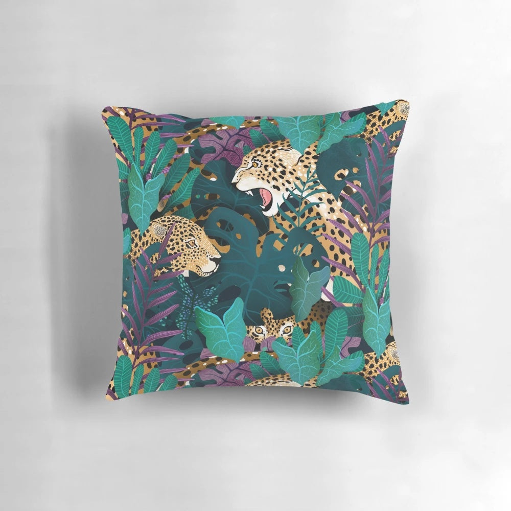 Plush jaguar-patterned pillow with lush tropical foliage design