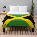 Colorful Jamaica-themed plush blanket with socks design