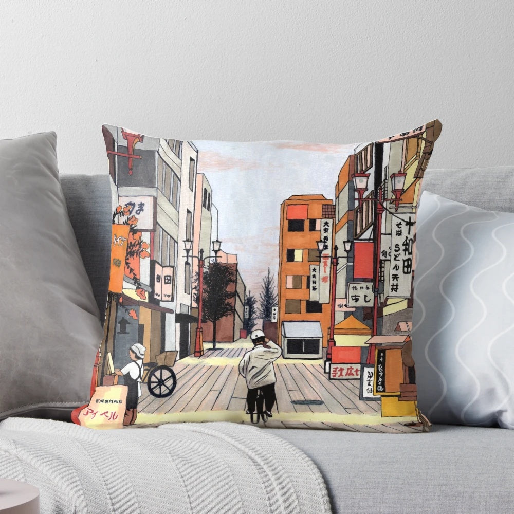 Colorful pillow featuring an anime-inspired illustration of an early morning bicycle ride through a modern Japanese cityscape