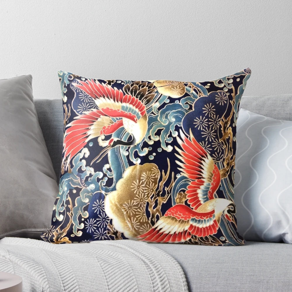 Decorative pillow featuring a vibrant Japanese-inspired design with flying cranes, floral patterns, and ocean waves in red, navy blue, and other colors.