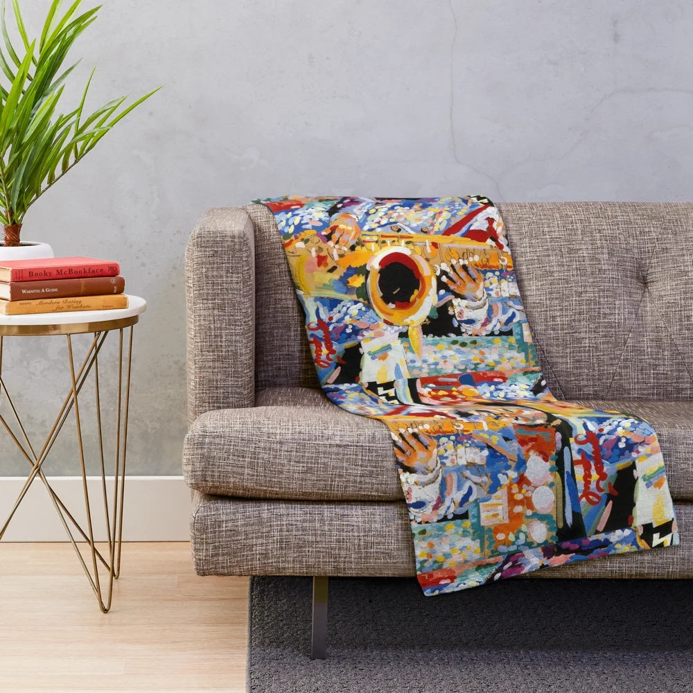 Jazz-inspired plush blanket featuring saxophone and Mardi Gras imagery
