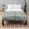 Colorful plush blanket with vibrant floral and animal pattern