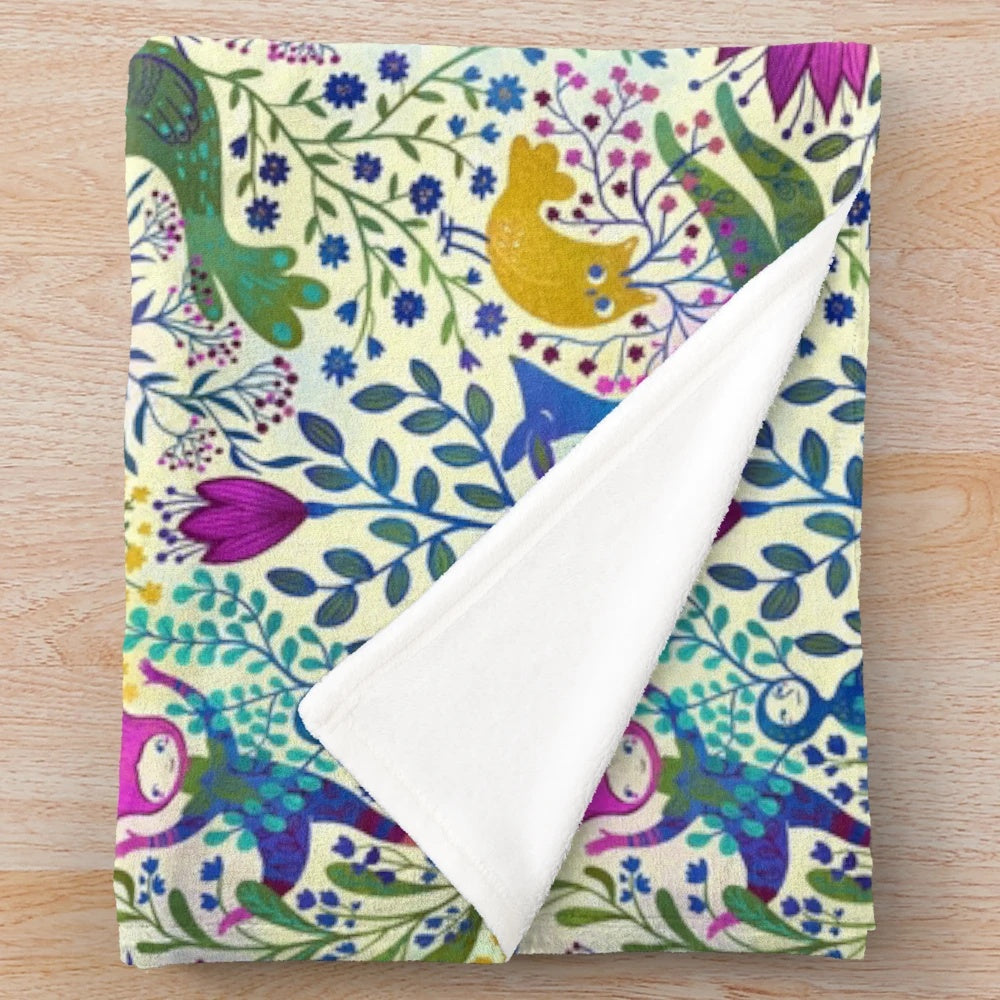Colorful plush blanket with vibrant floral and animal pattern