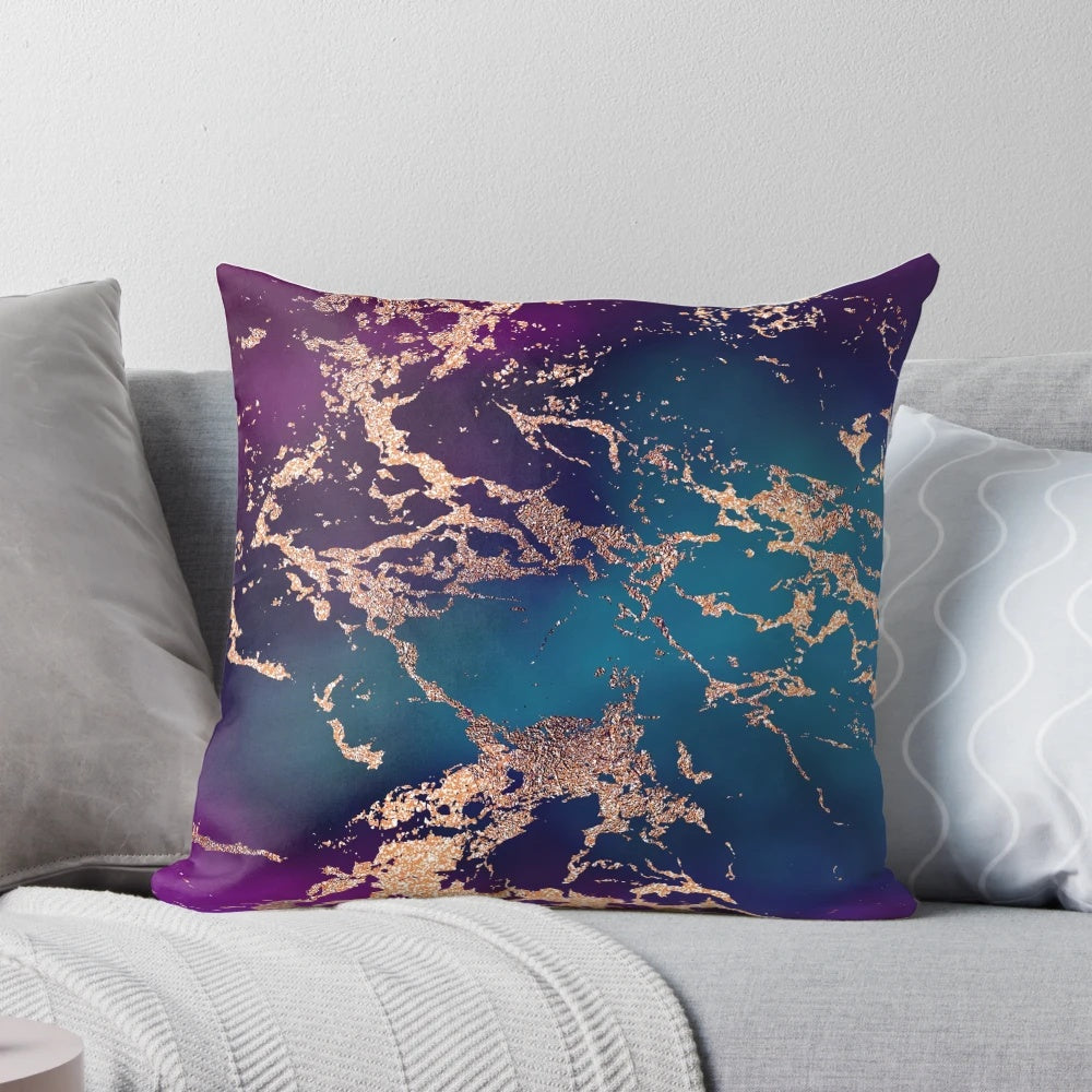 Vibrant jewel tone rose gold marble pillow in shades of turquoise, blue, and purple