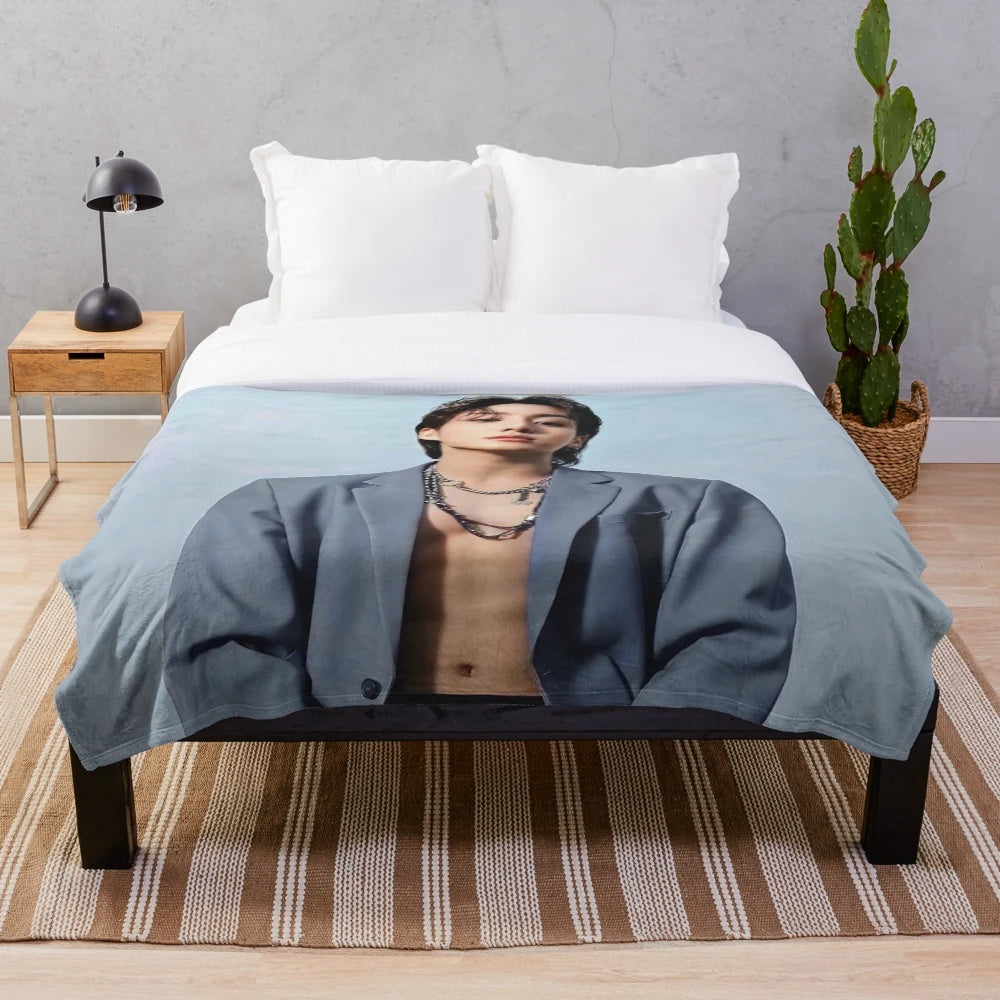Soft, colorful plush blanket featuring BTS member Jungkook