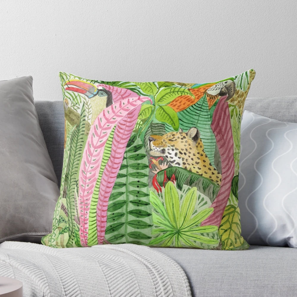 Lush jungle-inspired pillow with botanical leaves, flowers, and animal prints