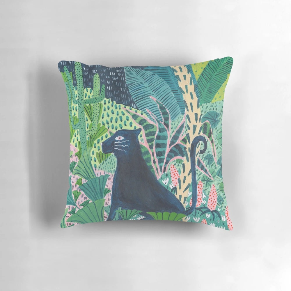 Decorative pillow featuring a lush, botanical jungle design with a jaguar or panther-like cat