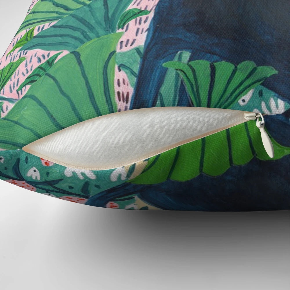 Decorative pillow featuring a lush, botanical jungle design with a jaguar or panther-like cat