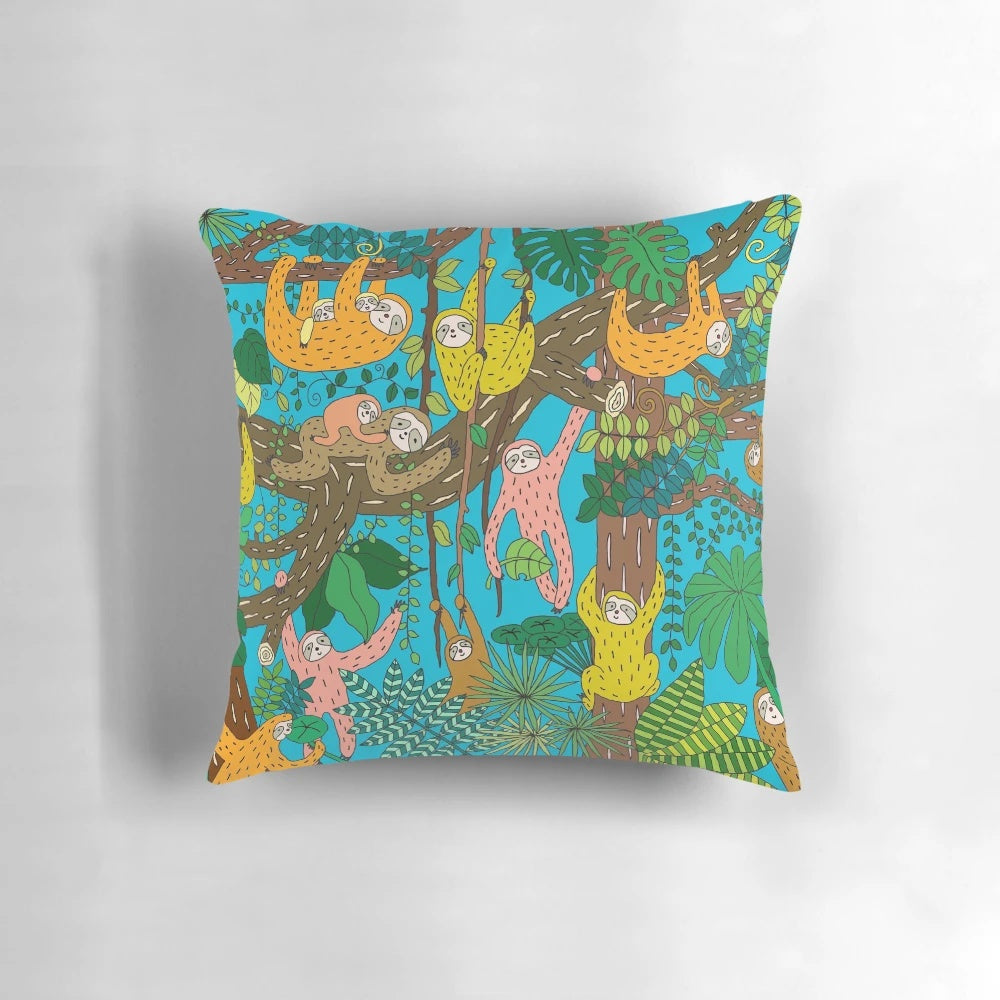 A colorful and graphic sloth pillow with a happy, smiling sloth design set in a lush, tropical jungle landscape.
