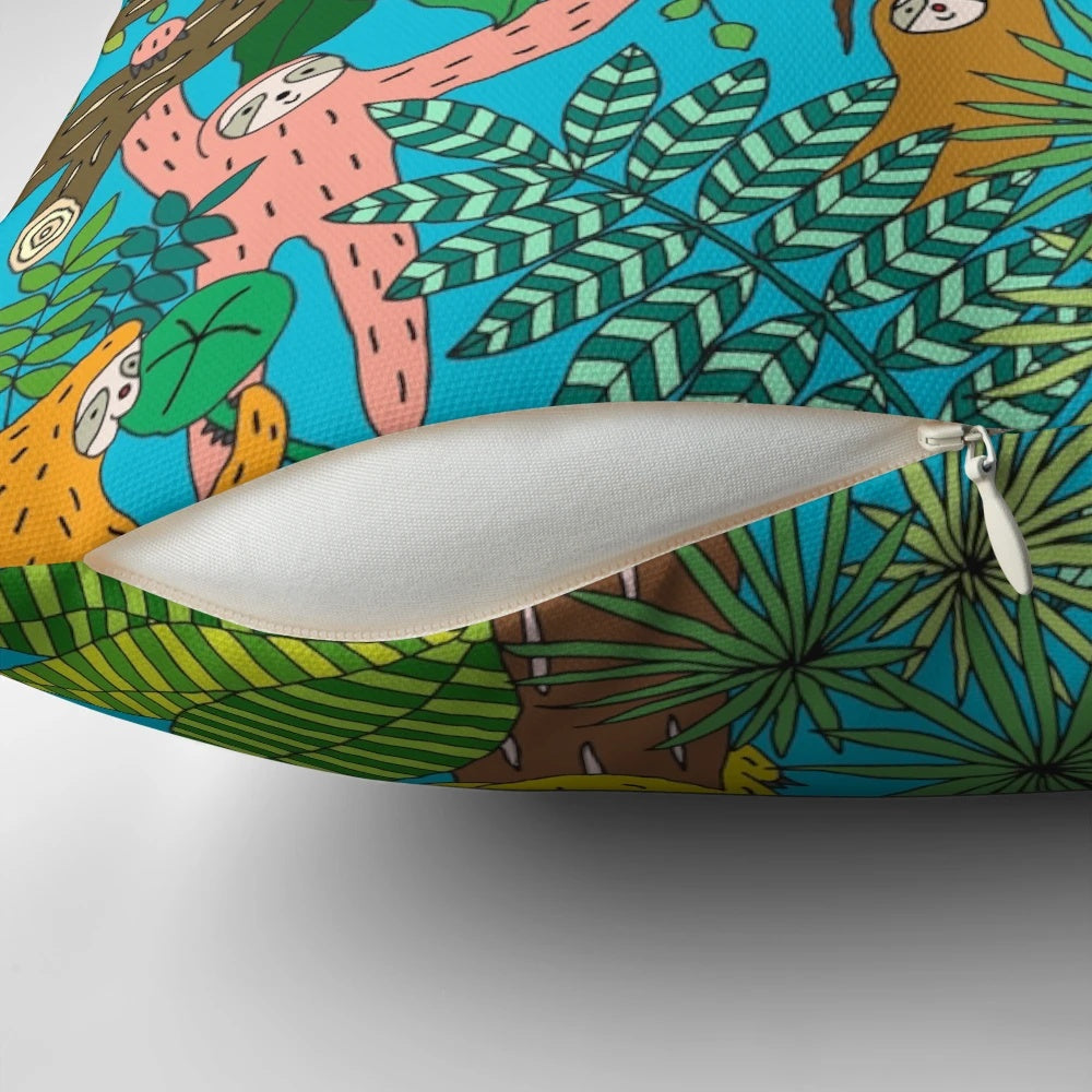 A colorful and graphic sloth pillow with a happy, smiling sloth design set in a lush, tropical jungle landscape.