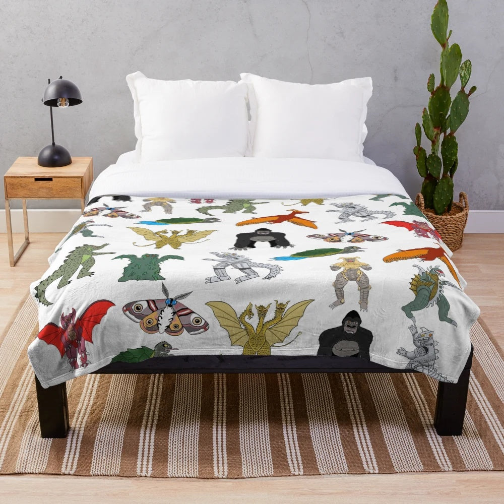 Colorful kaiju-themed plush blanket