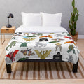 Colorful kaiju-themed plush blanket