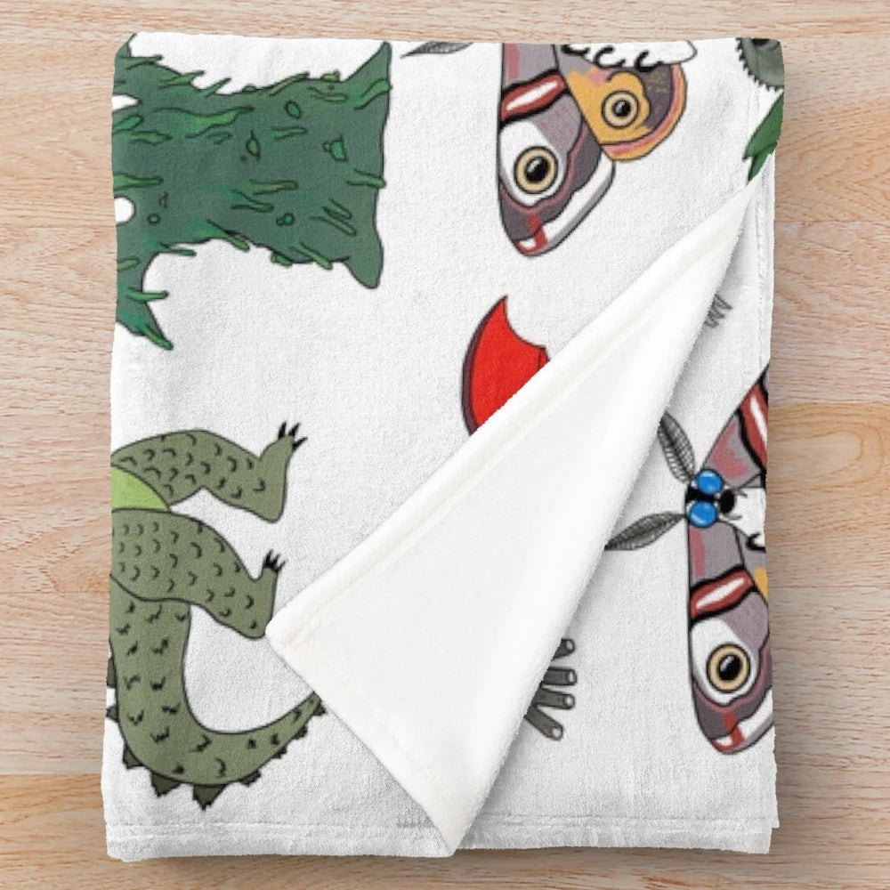 Colorful kaiju-themed plush blanket