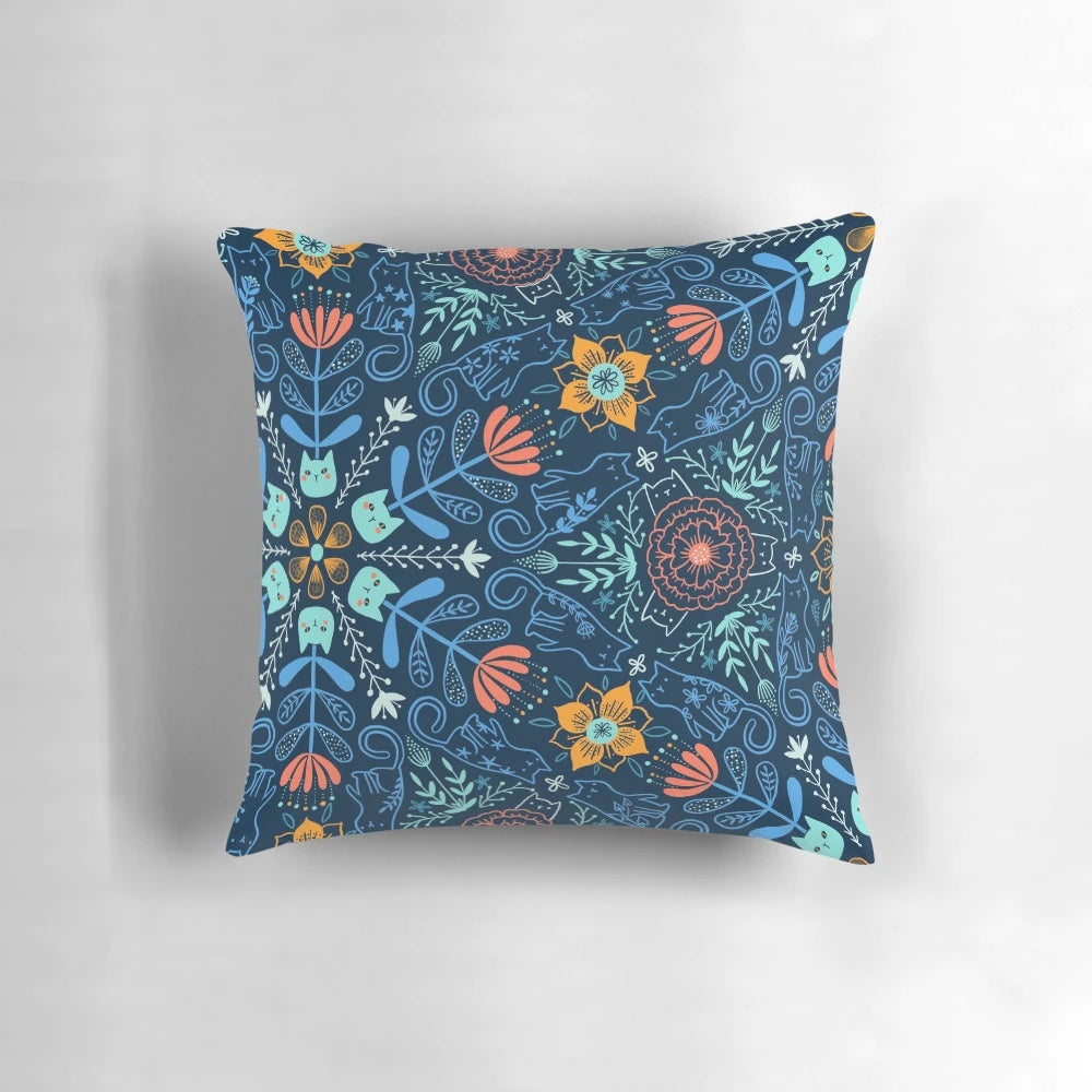 Colorful kaleidoscope pattern featuring cats and flowers on a soft, plush pillow