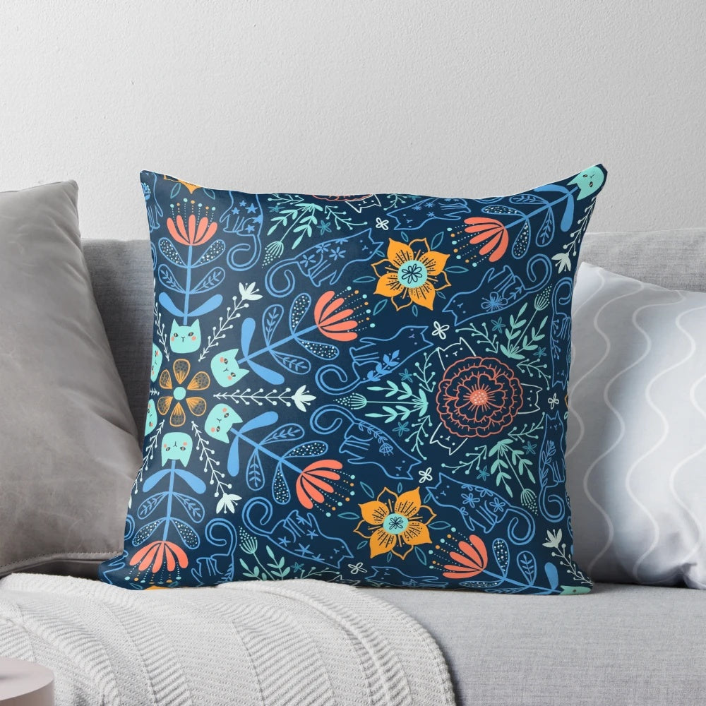 Colorful kaleidoscope pattern featuring cats and flowers on a soft, plush pillow