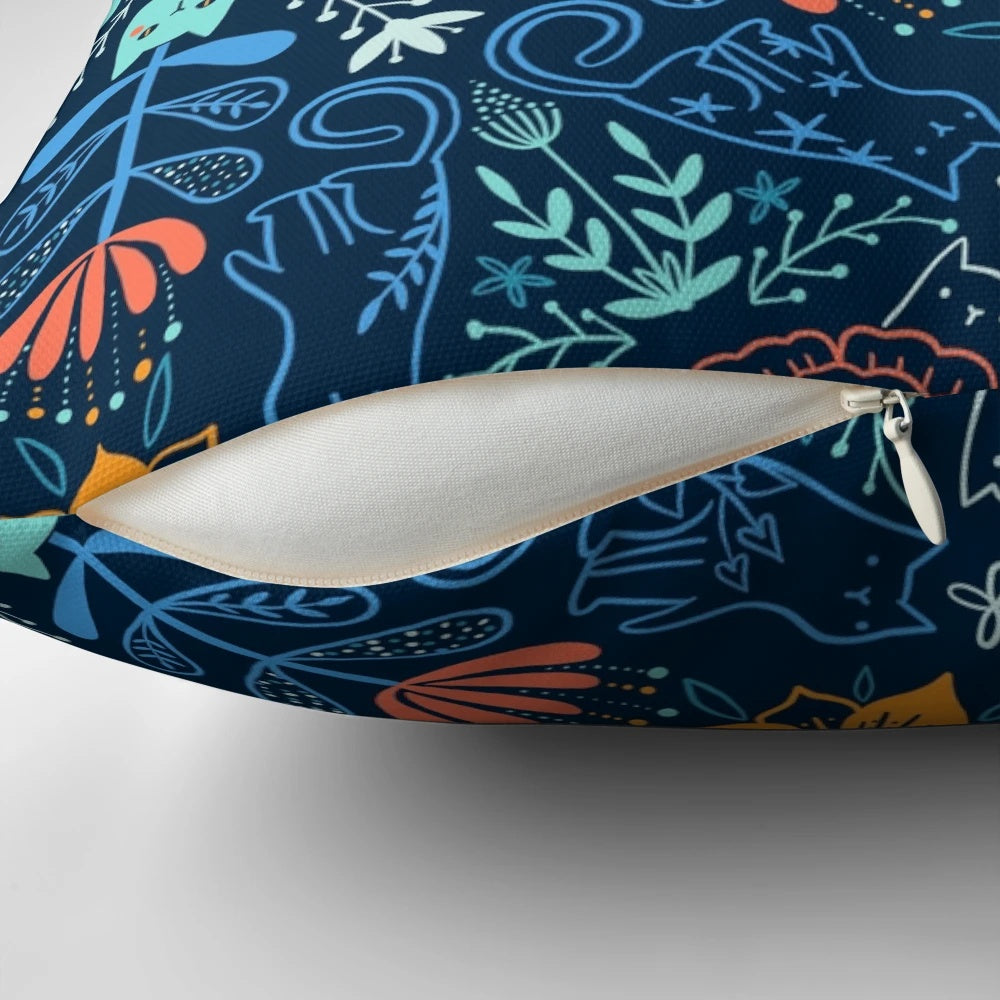 Colorful kaleidoscope pattern featuring cats and flowers on a soft, plush pillow