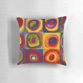 Colorful abstract pillow featuring a design of concentric squares and circles in a variety of bright hues, inspired by the artwork of Wassily Kandinsky.