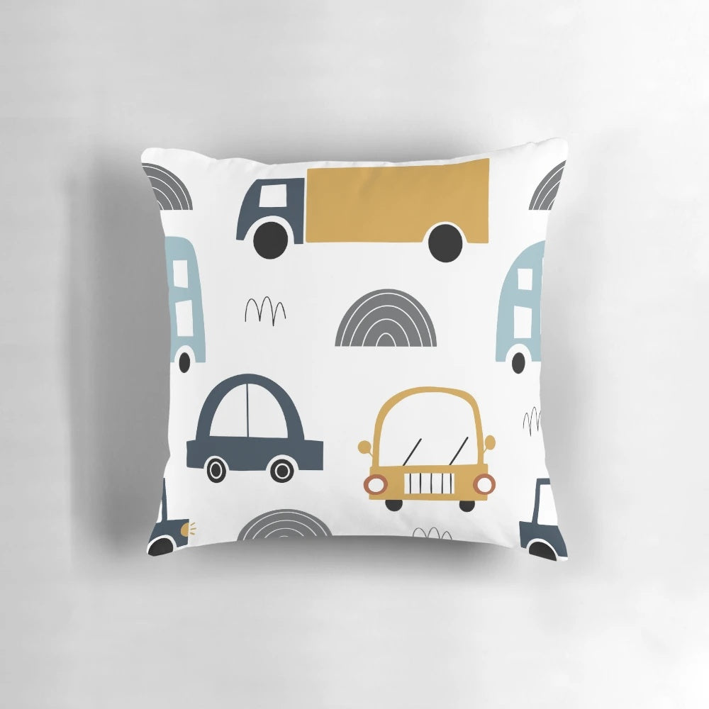 Colorful children's pillow featuring various vehicles like cars and trucks