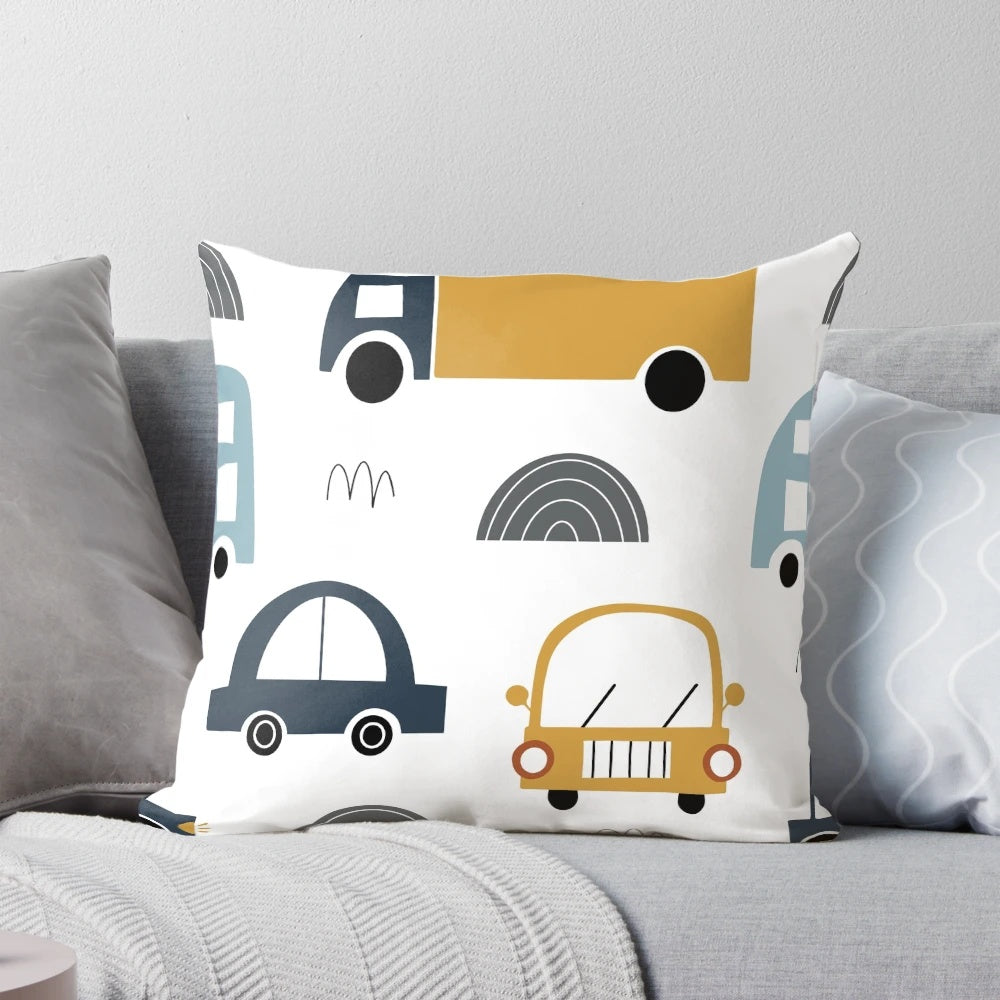 Colorful children's pillow featuring various vehicles like cars and trucks