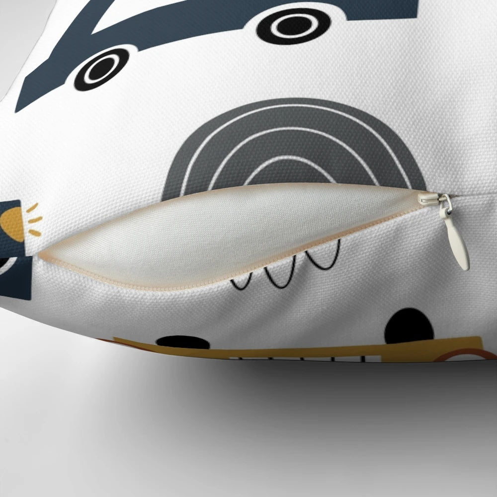 Colorful children's pillow featuring various vehicles like cars and trucks