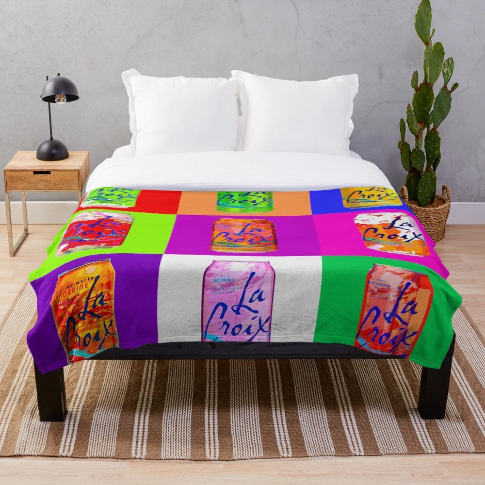 Colorful plush blanket featuring a pop art design of a LaCroix soda can
