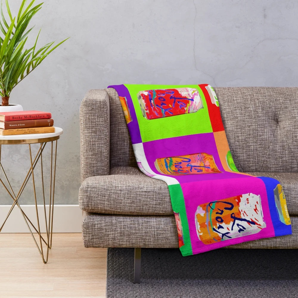 Colorful plush blanket featuring a pop art design of a LaCroix soda can