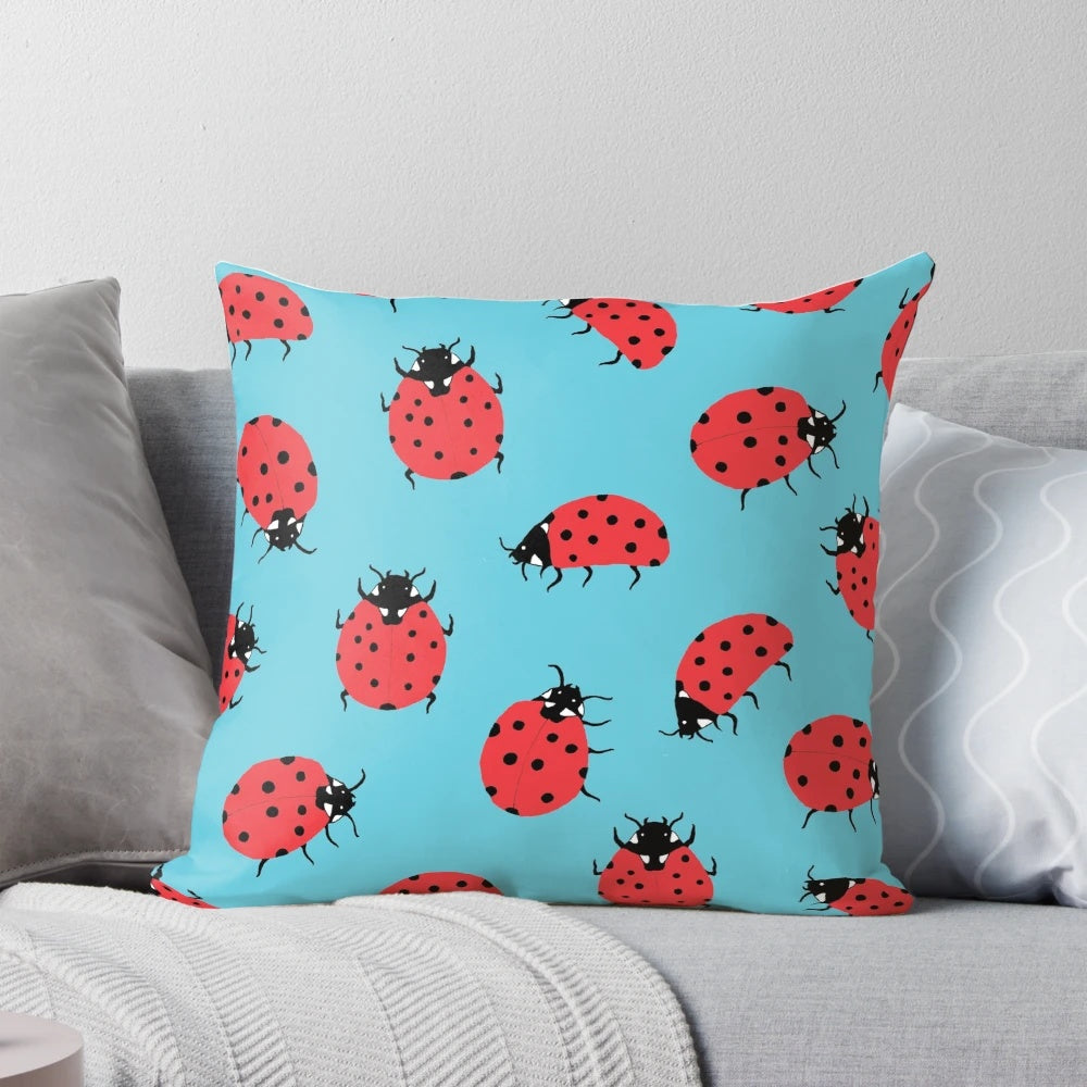 Colorful ladybug pattern decorative throw pillow featuring vibrant red and black design