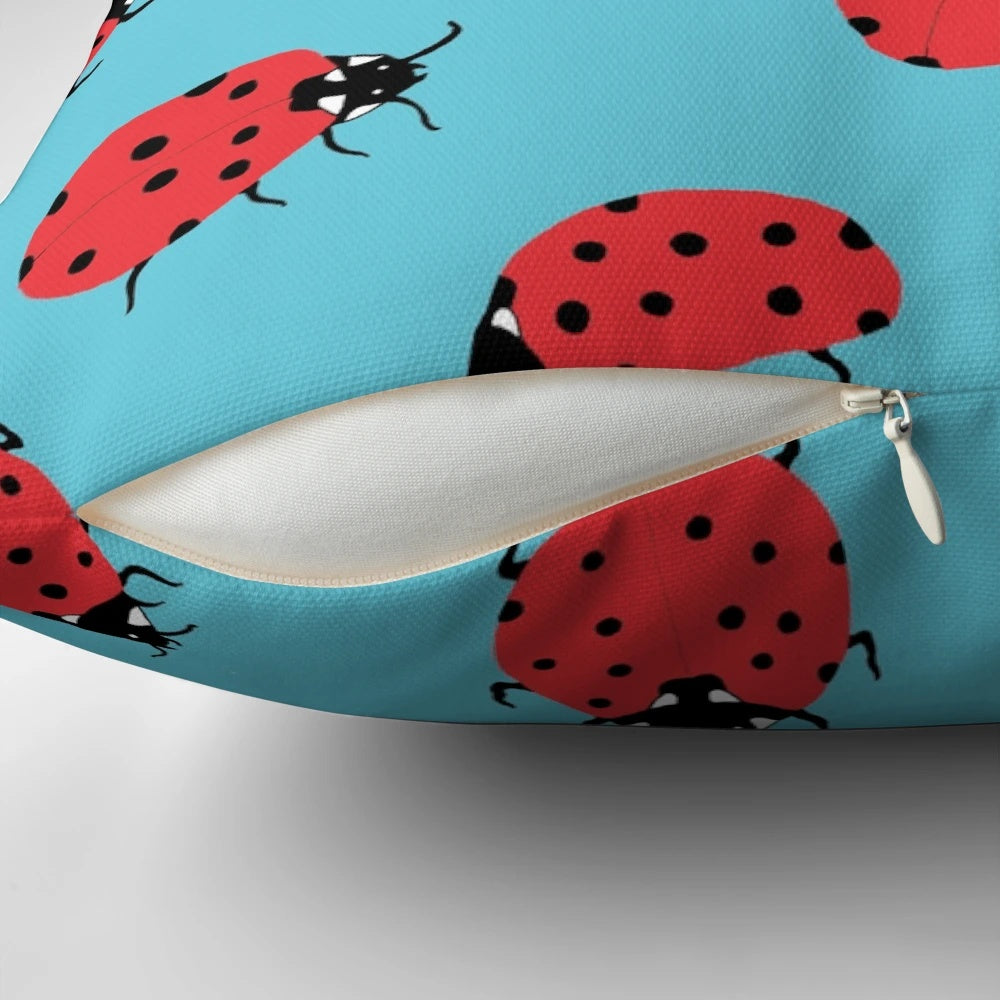 Colorful ladybug pattern decorative throw pillow featuring vibrant red and black design