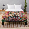 Plush blanket featuring vibrant leaves pattern inspired by Seraphine Louis' artwork