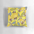 Colorful pillow with a design featuring a lemon, bees, and a garden scene