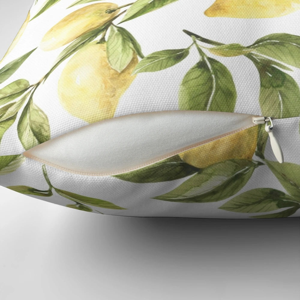 Colorful pillow featuring a summer pattern with yellow lemons, green leaves, and a botanical design.