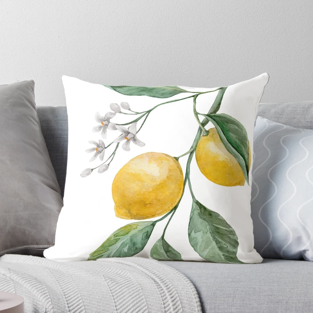 Decorative throw pillow featuring a watercolor painting of a lemon branch with leaves and lemons