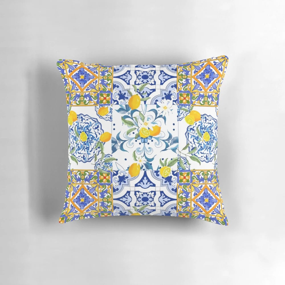 Colorful mosaic pattern pillow featuring lemons, flowers, and a Mediterranean-inspired design.