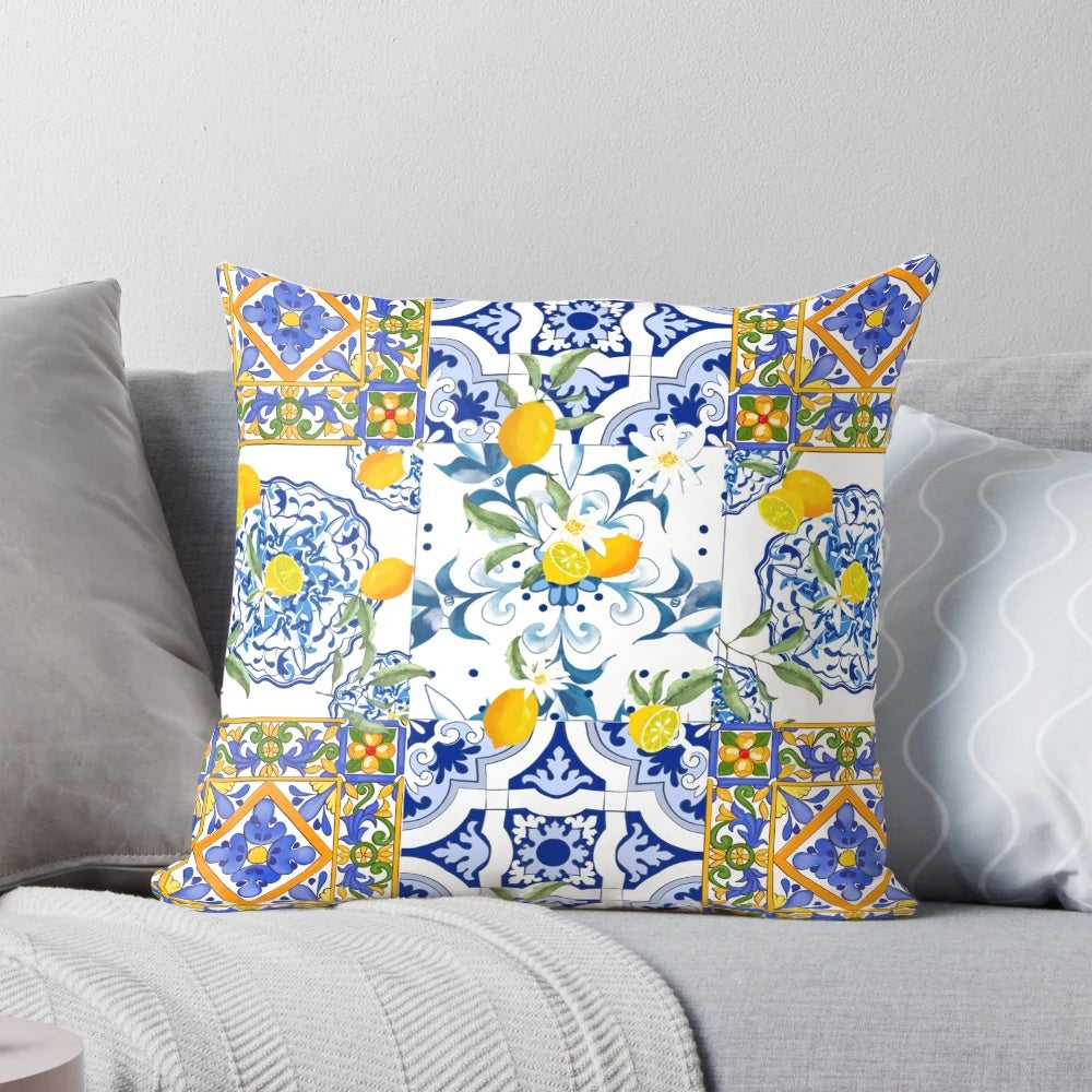 Colorful mosaic pattern pillow featuring lemons, flowers, and a Mediterranean-inspired design.
