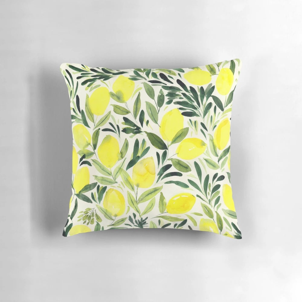 Lemons watercolor painting on a cream white pillow