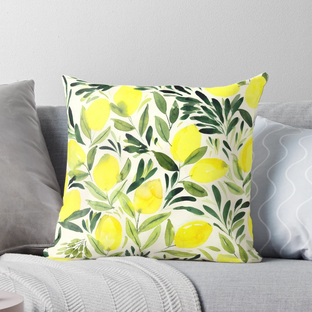 Lemons watercolor painting on a cream white pillow