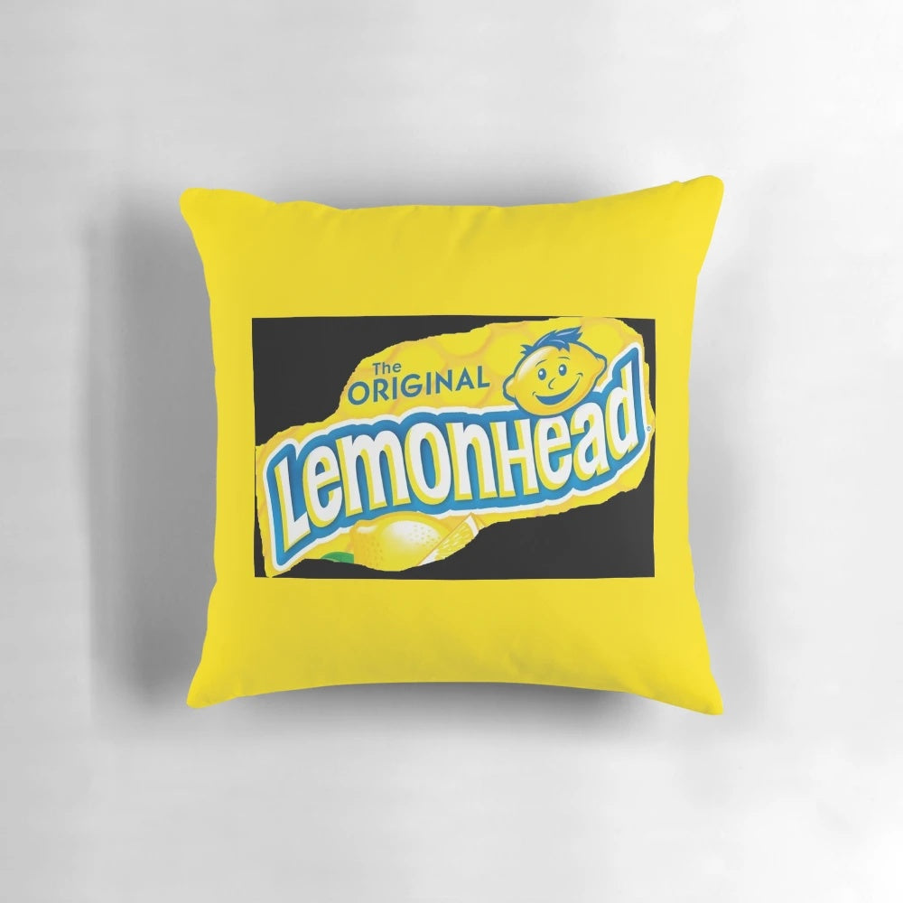 Colorful pillow featuring the iconic Lemonhead candy design, perfect for adding a touch of humor and sweetness to any room.
