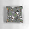Colorful pillow featuring a repeating pattern of various lemur species native to Madagascar