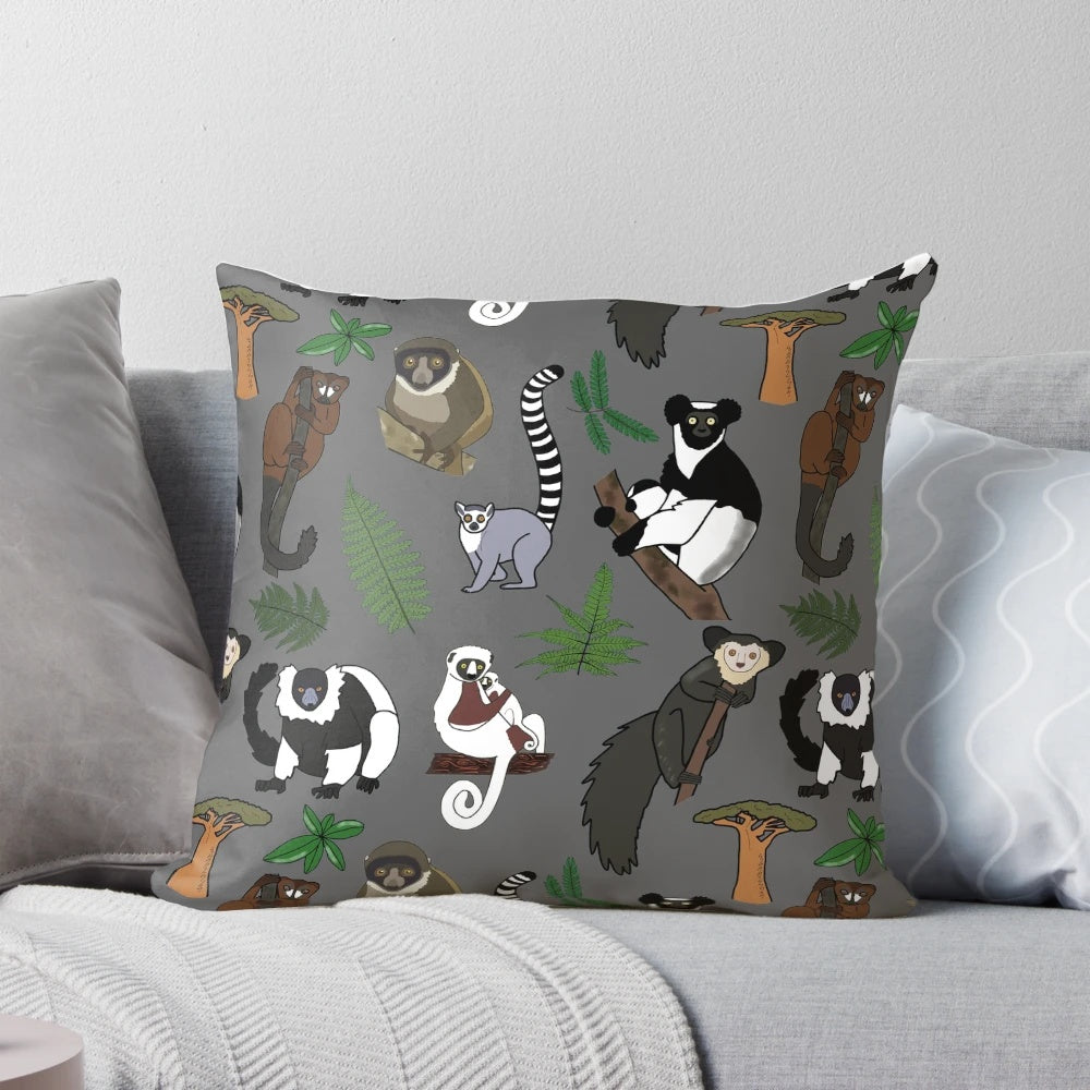 Colorful pillow featuring a repeating pattern of various lemur species native to Madagascar