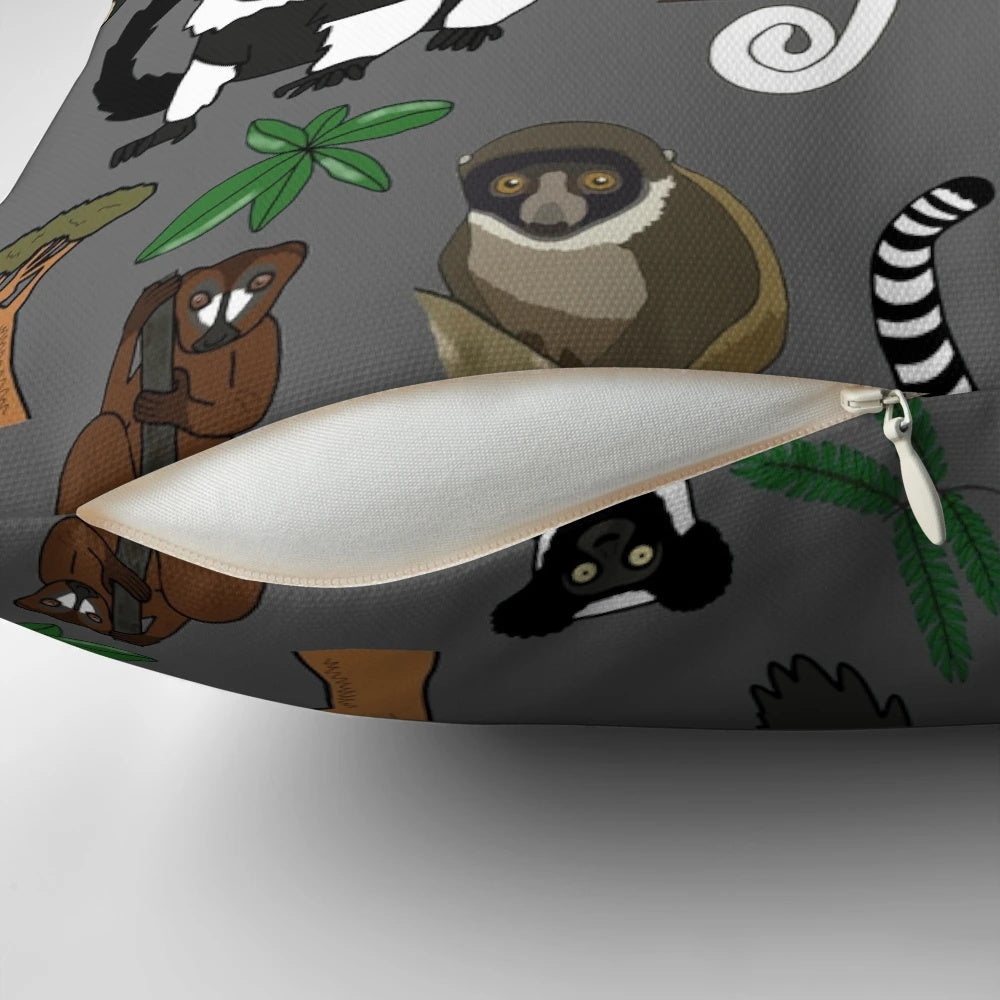 Colorful pillow featuring a repeating pattern of various lemur species native to Madagascar